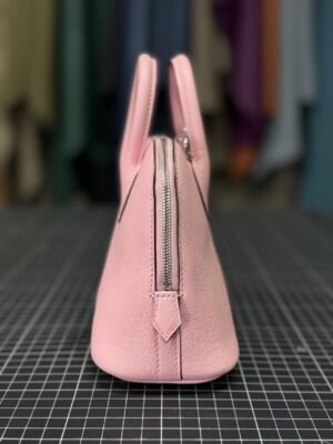 Hermès Bolide 1923 25 in delicate Rose Sakura (3Q Pink) Chevre (Goatskin), a timeless blend of vintage charm and modern elegance. - Image 3