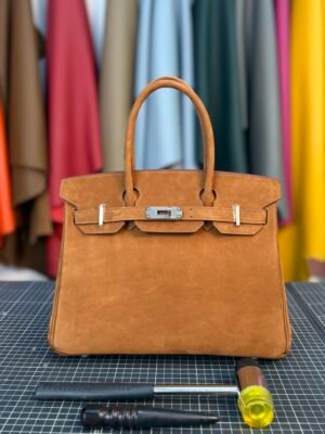 Hermès Birkin 30 in warm Gold (Gold Brown) Suede with luxurious silver hardware