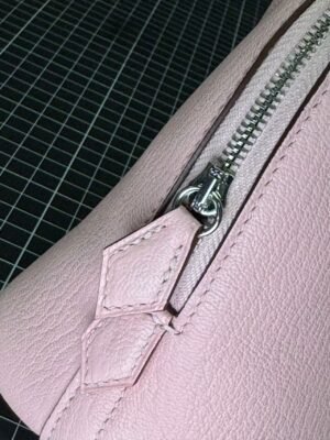 Hermès Bolide 1923 25 in delicate Rose Sakura (3Q Pink) Chevre (Goatskin), a timeless blend of vintage charm and modern elegance. - Image 7