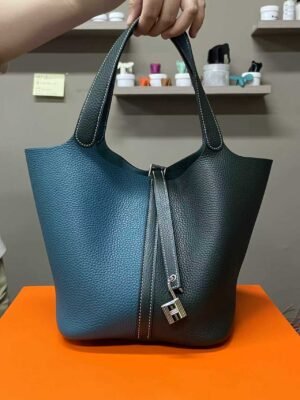 Hermès Picotin Lock 22 in a striking two-tone combination of Vert Cypres (Cypress Green) and Bleu de Bosphore (Bosphorus Green) Clemence leather