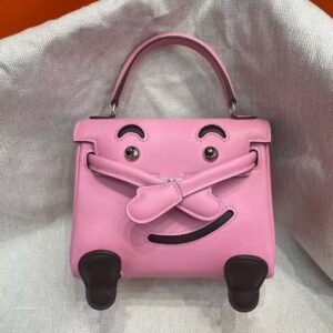 Hermès Kelly Doll Millennial Bag in vibrant Rose Confetti Swift leather with whimsical smiley face details, a playful icon of 2000s luxury
