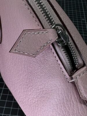 Hermès Bolide 1923 25 in delicate Rose Sakura (3Q Pink) Chevre (Goatskin), a timeless blend of vintage charm and modern elegance. - Image 4